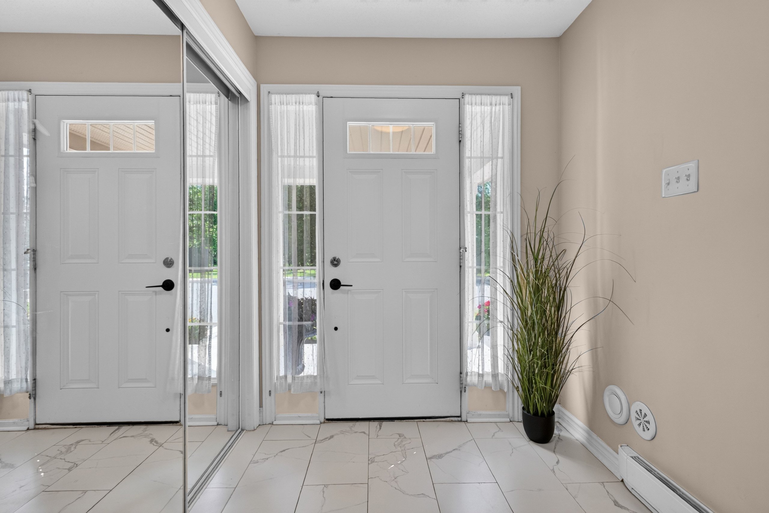Front entry with mirrored closet