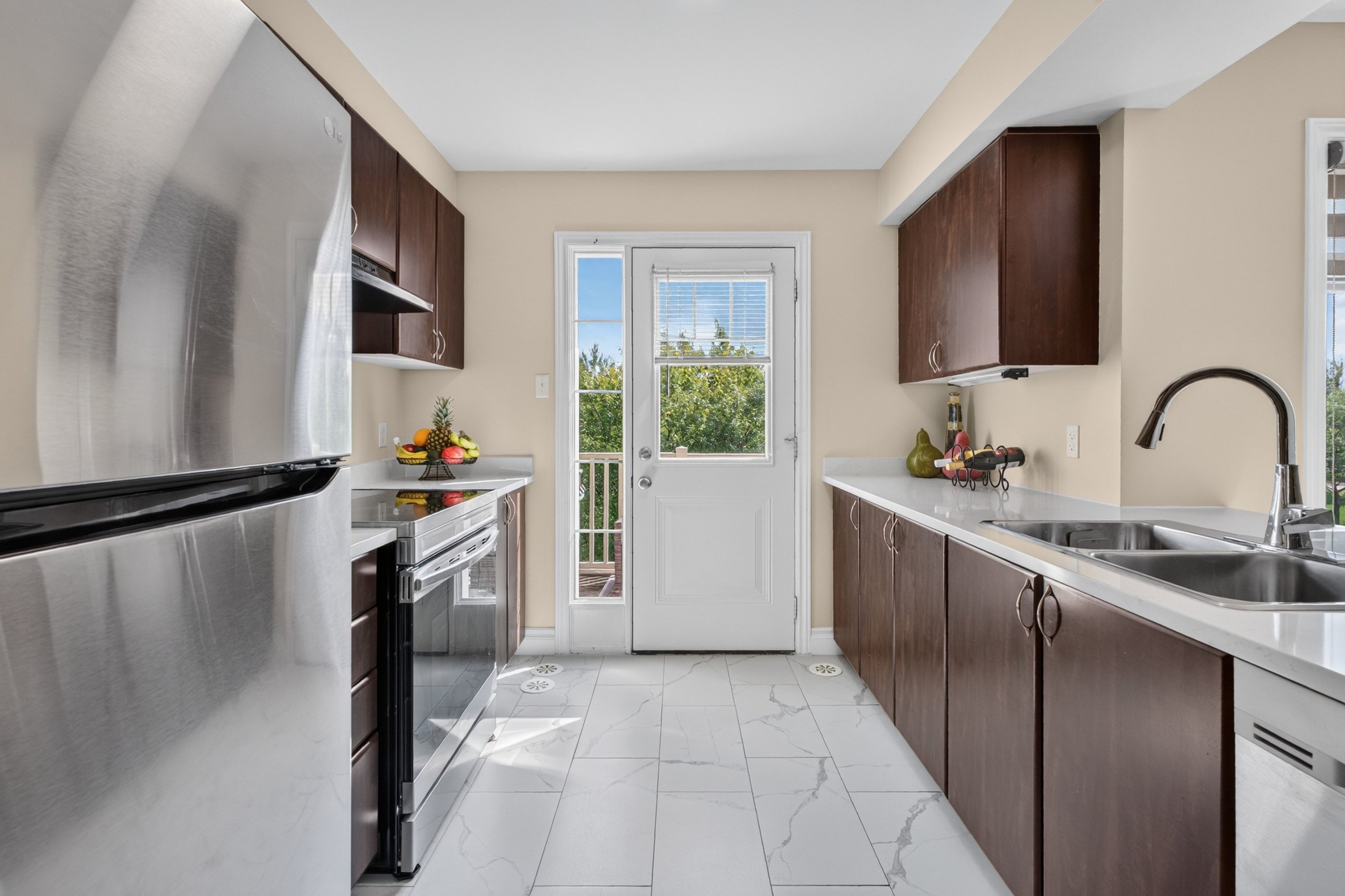 Kitchen with quartz counters and stainless appliances